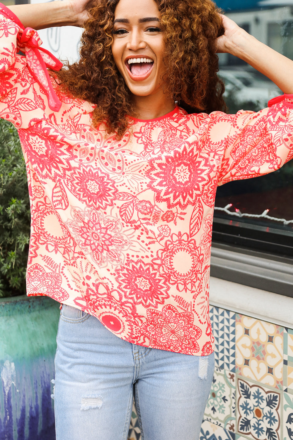Macarena® | Long sleeve top with bow tie and contrast floral print in red and coral