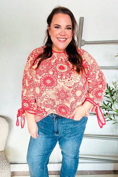 Macarena® | Long sleeve top with bow tie and contrast floral print in red and coral