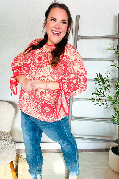 Macarena® | Long sleeve top with bow tie and contrast floral print in red and coral